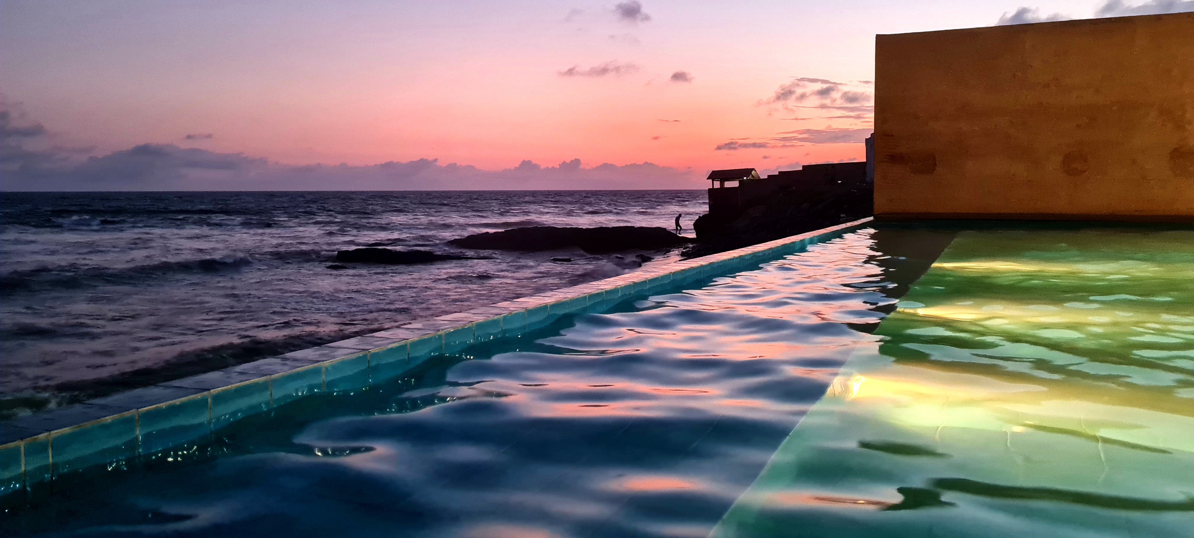 Pool and sea view at sunset in Ghana